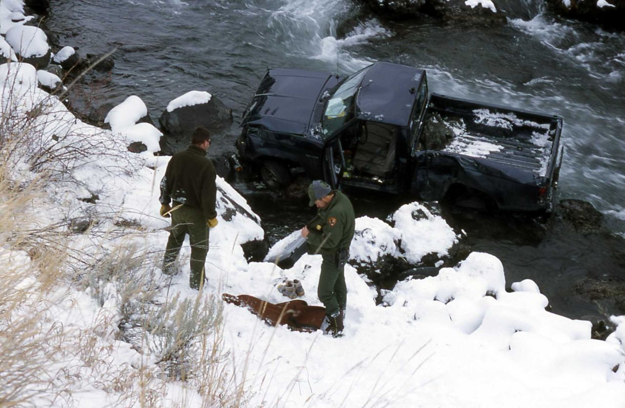 Rangers Keith Young & Jeff Hereford at the site of a motor vehicle accident in the Gardner River/Gardner River Canyon Photo