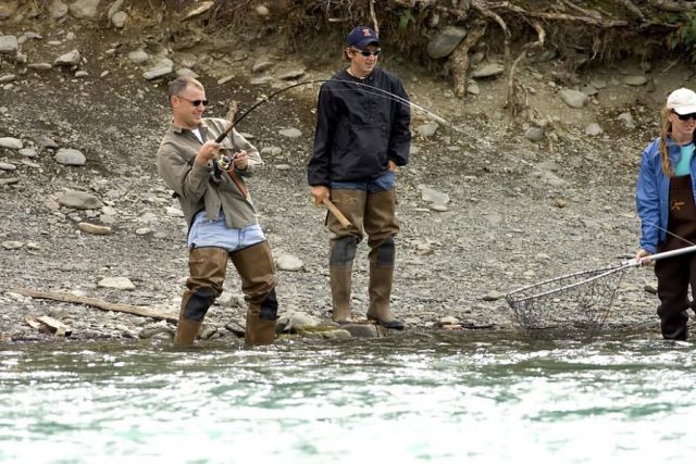 Fisherman with One on the Line Picture