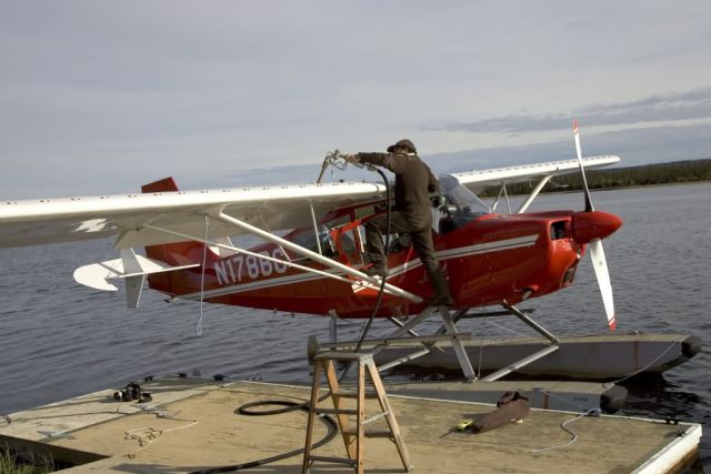 Kanuti floatplane being fueled at VOR Lake in Bettles Picture