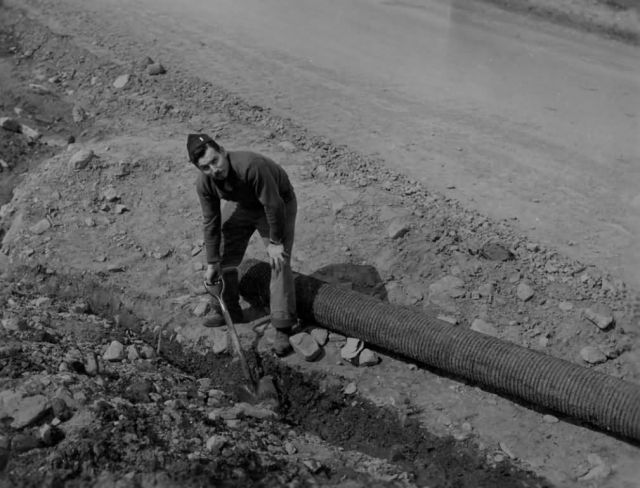 Serviceman Digging Trench Picture