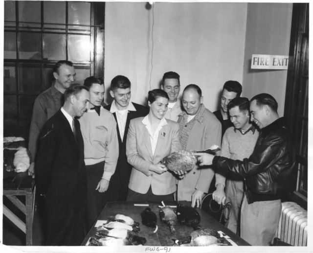 Brina Kessel Describes Goose to Military Personnel Picture