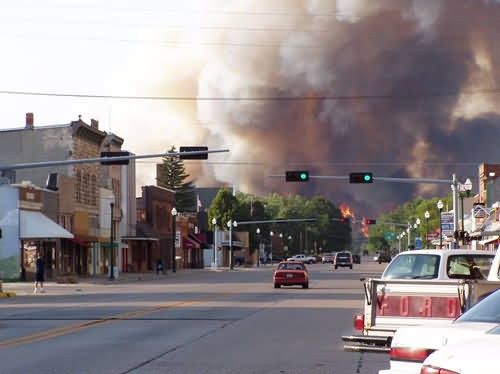 r6-ne-var-fire burns behind city Picture
