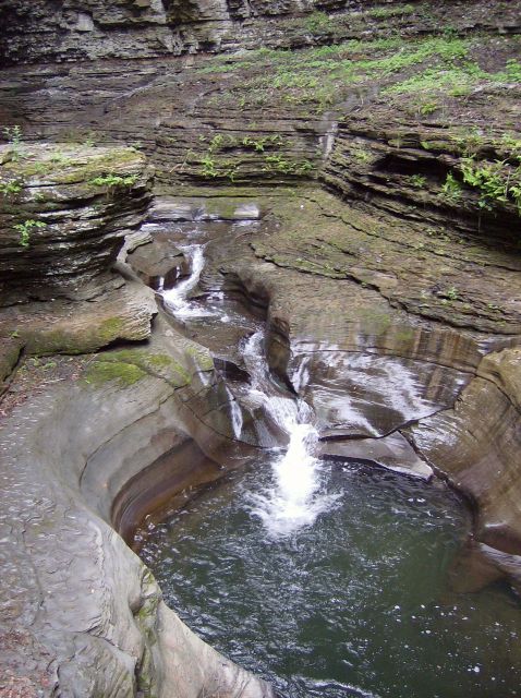Babbling stream flowing into a bowl-like pool at Watkins Glen State Park. Picture