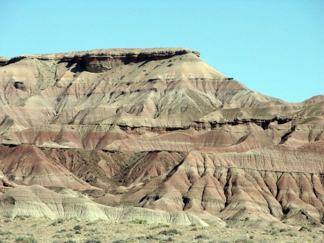 A mesa with red and grey sedimentary layers Picture