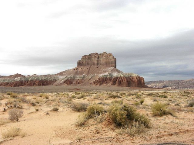 A red and white mesa looking vaguely like the silhouette of an aircraft carrier Picture