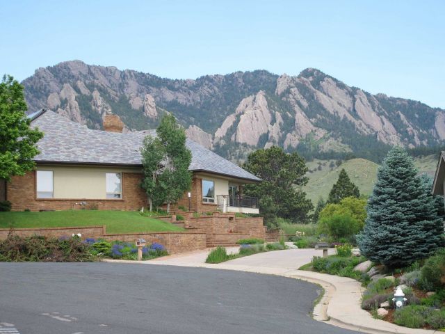 The Flatirons and foothills of the Rocky Mountains are seen from the front yard of a Boulder resident. Picture