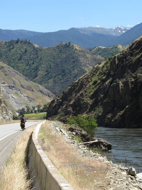 The Salmon River Canyon with a touring cyclist enjoying a beautiful day. Picture