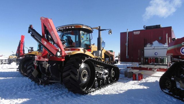 Caterpillar tractor with Fassi knuckle boom. Picture