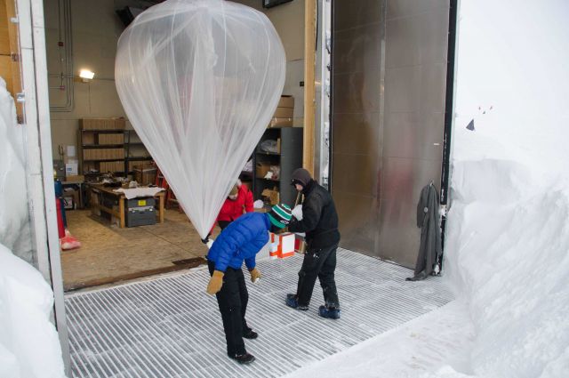 Launching an ozonesonde balloon. Picture