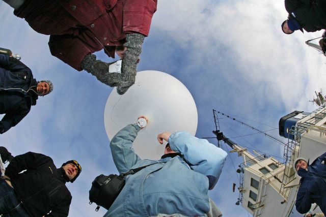 Launching a radiosonde balloon to study atmospheric conditions throughout the atmosphere to very high altitudes, sometimes greater than 25 km above th Picture