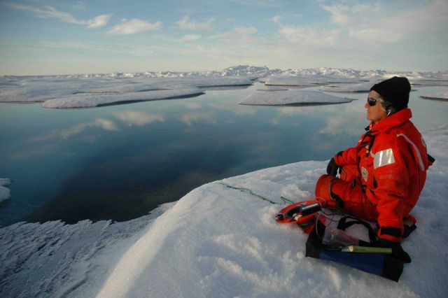 Sue Moore listening intently to real-time sounds captured by an underwater hydrophone Picture