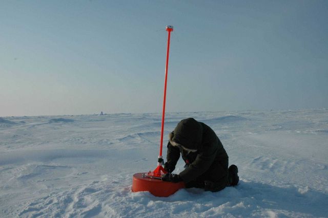 Placing an ice beacon that measures air temperature and pressure and monitors motion of ice. Picture