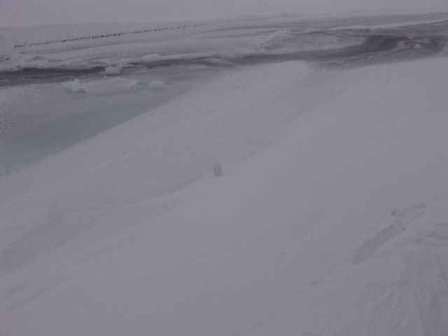 The top of an SVP-BT buoy frozen into the ice and covered by snow Picture
