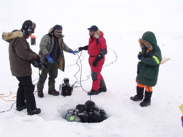 Ice diver returning to egress hole. Picture