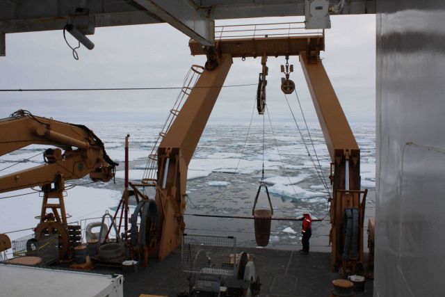Rock dredge being deployed from stern of CG icebreaker HEALY. Picture