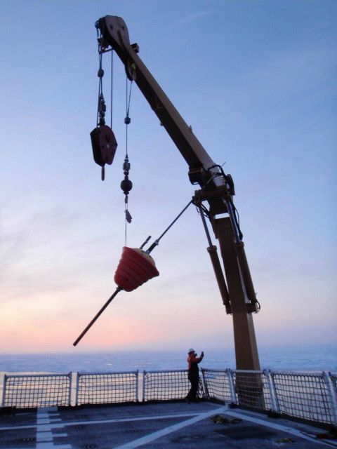 Deploying an ice buoy in open water hoping for freezing in and survival in the harsh Arctic environment. Picture