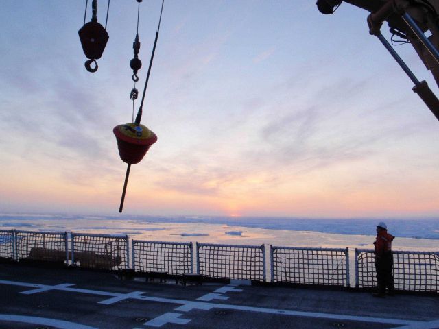 Deploying an ice buoy in open water hoping for freezing in and survival in the harsh Arctic environment. Picture