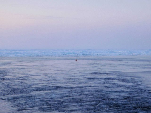 Deploying an ice buoy in open water hoping for freezing in and survival in the harsh Arctic environment. Picture