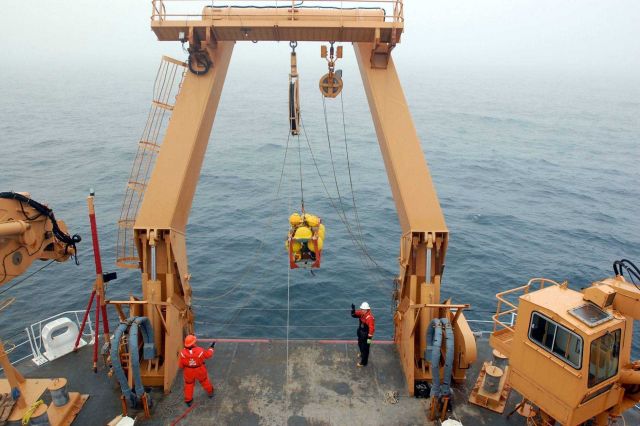 Instrument package being deployed from stern of CGC HEALY. Picture