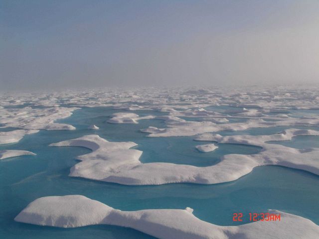 On a clear summer day, a series of interlocking melt pools show as beautiful aquamarine reminiscent of shallow tropical lagoons. Picture