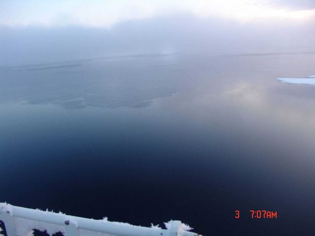 Frazil ice seen through the fog in a polynya. Picture