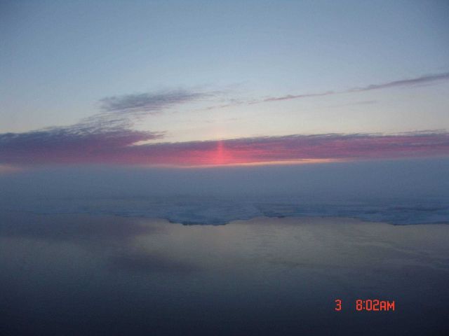 A sun pillar seen above the pack ice fringing a polynya. Picture