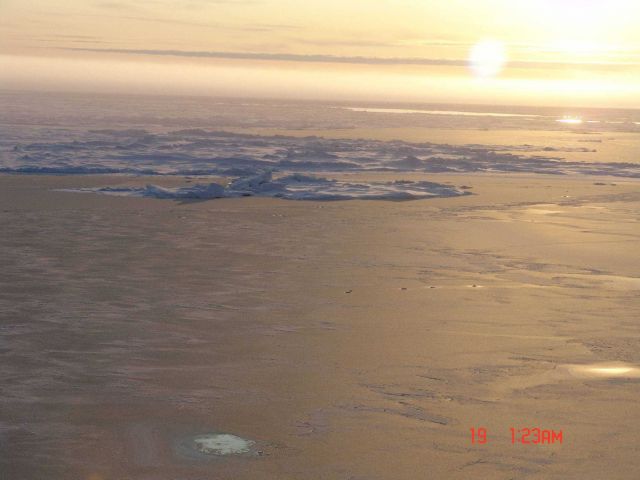 New ice formed over a polynya with ice ridges and mult-year ice in distance. Picture