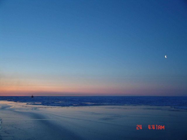 Moon, pack ice and new ice in a polynya or perhaps at the edge of the pack ice Picture