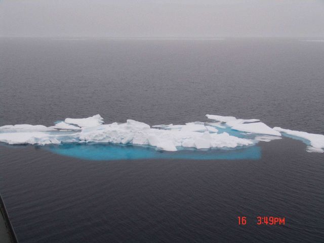 Remants of a ridge showing relatively deep blue green ice below Picture