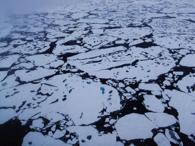 Helicopter eye view of ice floes, melt ponds, areas of brash ice, and other phenomena. Picture