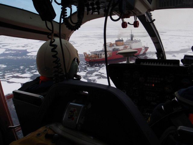 Helicopter approaching the USCGC HEALY after an overflight of ice. Picture