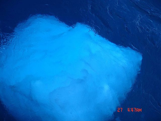 A block of ice seen through the water. Picture