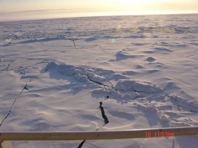 Fractures extending to a frozen lead filled with brash ice. Picture