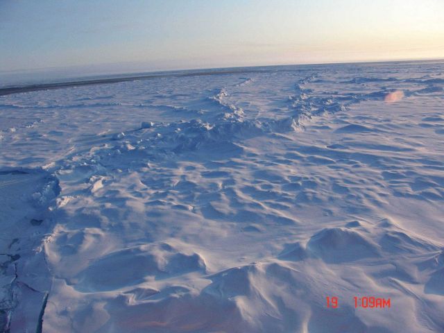 Ridges and hummocks in multi-year ice and an open lead. Picture
