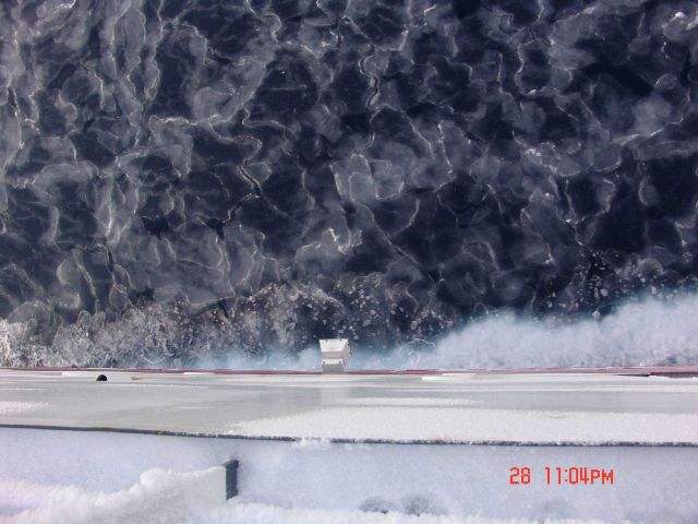 Interlocking pancake ice which with further freezing and jostling will form larger floes. Picture