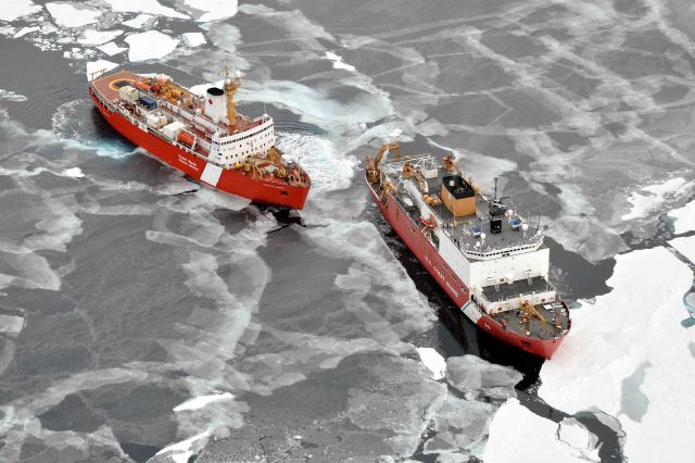 USCG icebreaker HEALY in relatively smooth first-year ice floes and nilas ice followed by the Canadian Coast Guard icebreaker LOUIS S Picture