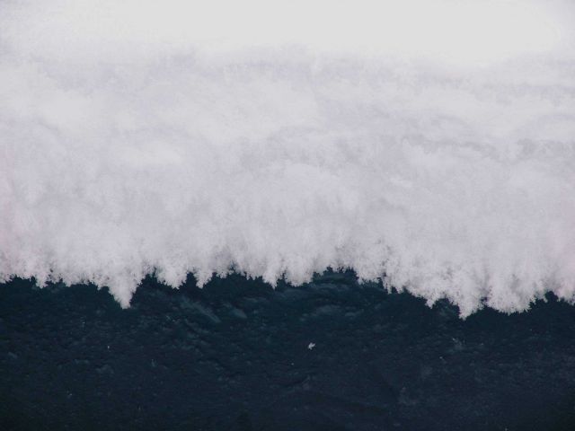 Ice crystals at edge of water/ice surface in crack in ice pack. Picture