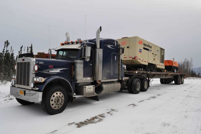 Truck hauling equipment to Prudhoe Bay oil field along the Dalton Highway. Picture