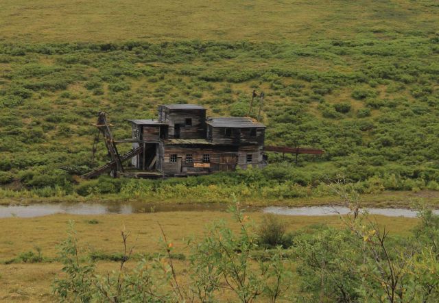 A deserted gold dredge along the Nome to Council road. Picture