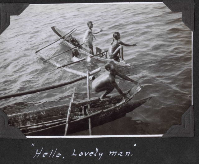 Children greeting a Coast Survey ship upon its arrival in port and begging for coins to be tossed in the water. Picture