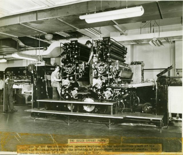 Harris presses in the press room in the basement of the Department of Commerce Building. Picture