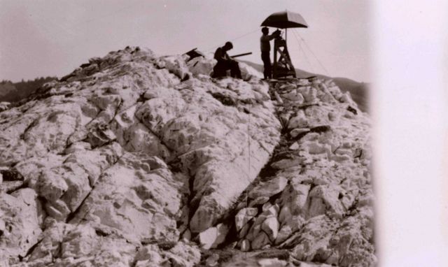 Lieutenant William Tucker observing at an offshore triangulation station south of Monterey. Picture