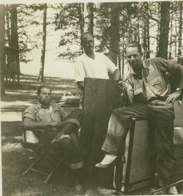 Clarence Olson, Bill Husemeyer, and Floyd Risvold breaking camp at Graingerville, Idaho. Picture
