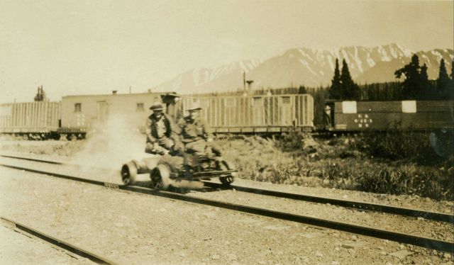 A gasoline powered velocipede underway near a railroad siding on the Anchorage to Fairbanks railway. Picture