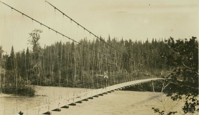 Crossing over one of the many rivers in central Alaska on a suspension bridge Picture