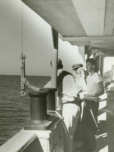 Chief Survey Technician securing Nansen bottle for temperature- water characteristic studies on line Picture