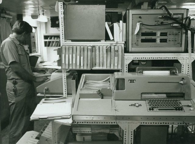 Instrument racks, teletypes, and computer tapes (including paper tapes) on C&GS vessel circa 1970 Picture