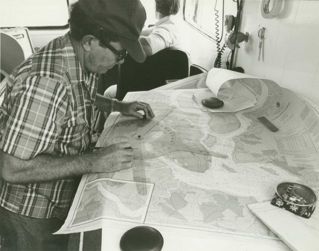 Personnel from NOAA's Atlantic Marine Center update the hydrography and evaluate sounding data on the nautical chart for the Cooper River. Picture