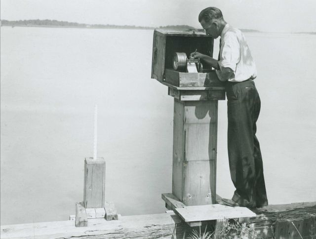 Lake Survey employee Jim Morris annotating water level gauge. Picture