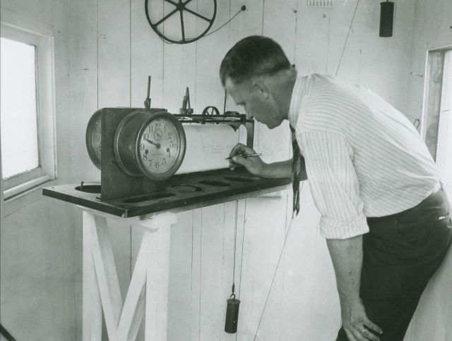 Lake Survey employee Jim Morris annotating water level gauge. Picture